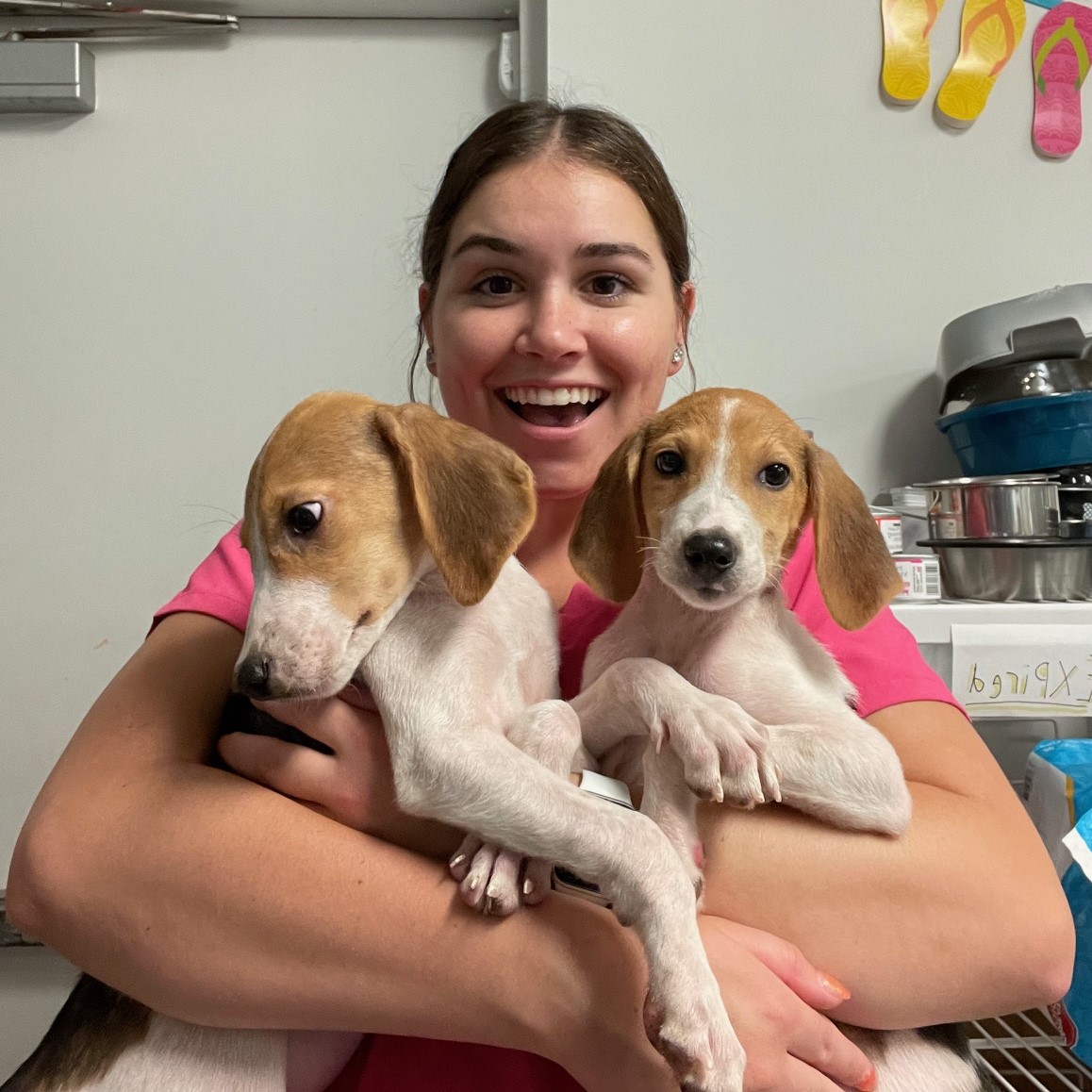 Jenna Carter with two puppies